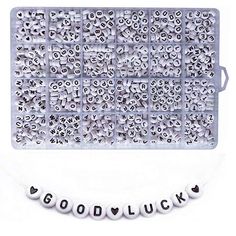 a plastic tray with beads that spell out good luck on the front and back of it