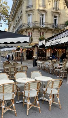 tables and chairs are set up outside on the street