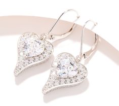 Maximize your sparkle with these dazzling drop-style Diamonique x Jennifer Miller heart-shaped earrings. Boasting a heart-cut cubic zirconia Diamonique simulated diamond in the center surrounded by a handsome halo of faceted round stones, these look-at-me lever backs provide plenty of pizzazz. Heart Shaped Halo Design Wedding Earrings, Heart-shaped Halo Design Wedding Earrings, Anniversary Heart Cut Halo Earrings, Heart-shaped Diamond Earrings With Accents For Anniversary, Glamorous Heart-shaped Anniversary Earrings, Jennifer Miller, Halo Earrings, Heart Shaped Earrings, Earrings Sterling Silver