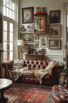 a living room filled with furniture and lots of pictures on the wall above it's windows