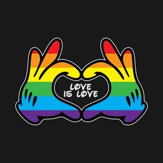 two hands making a heart shape with the words love is love painted on it in rainbow colors