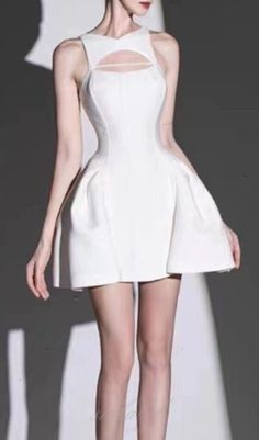 This dress features a sleeveless design with strategically placed cut-outs that add an alluring touch to the silhouette. The corset-inspired bodice cinches the waist, accentuating your curves and providing a flattering fit. Made from high-quality fabric, the dress drapes gracefully, highlighting your figure while offering comfort and ease of movement. The crisp white hue adds a fresh and sophisticated vibe, making it an ideal choice for various occasions, from cocktail parties to summer soirees. A-line Mini Dress With Boned Bodice, Sleeveless Cocktail Mini Dress With Corset Back, Sleeveless Mini Dress With Corset Back For Cocktail, White Mini Corset Dress For Evening, Sleeveless Fit And Flare Corset Dress With Boned Bodice, A-line Mini Dress With Corset Back, Sleeveless Boned Bodice Fit And Flare Corset Dress, Elegant Stretch Mini Dress With Cut-out Waist, Elegant Mini Dress With Stretch And Cut-out Waist