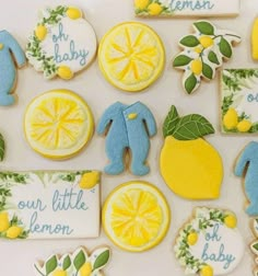 decorated cookies with lemons, lemon slices and baby names