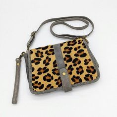 Check out this leopard print suede crossbody bag from Vera Pelle in gray. Brand Name: Vera Pelle Market: women Size: small Color: gray tan black brown Style: crossbody, detachable adjustable strap, leopard animal print, converts to clutch, snap close, inner zip pocket, made in Italy Material: suede leather Approximate measurements: 9.5 in wide, 7 in high, 2.5 in deep Condition: great pre-owned Check out my other listings and bundle them for a special discount. Don't miss out on this gray and tan Leather Shoulder Bag With Adjustable Strap In Leopard Print, Leopard Print Crossbody Shoulder Bag With Adjustable Strap, Leopard Print Crossbody Shoulder Bag For Everyday Use, Everyday Leopard Print Crossbody Shoulder Bag, Leopard Print Crossbody Bag, Convertible Crossbody Bag, Brown Style, Deep Conditioner, Leopard Animal