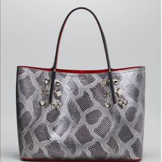 Rendered In Python Embossed Leather, This Iconic Tote Is Decorated With A Mixture Of Signature Polished Studs. Dual Handles Open Top With Clip Closure Silvertone Hardware Interior Slip Pocket Interior Main Compartment Leather Lining Leather Made In Italy Size 15"W X 9.75"H X 6.5"D. Handbags High-end Silver Bag With Palladium Hardware, High-end Silver Bags With Silver-tone Hardware, High-end Silver Bag With Silver-tone Hardware, Silver Luxury Bag For Everyday, Everyday Luxury Silver Bag, Silver Luxury Bag For Everyday Use, Luxury Metallic Bag With Silver-tone Logo Plaque, Luxury Metallic Silver Bag For Formal Occasions, Silver Bags For Everyday Luxury