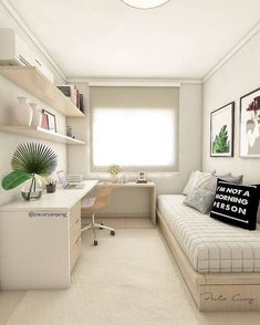 a small bedroom with a bed, desk and shelves on the wall next to it