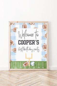 a football themed welcome sign is displayed in front of a white wall and wooden floor