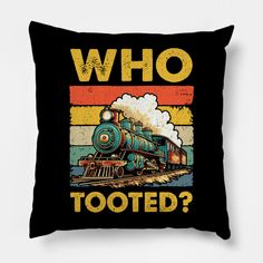 a black pillow with a train on it that says who tooted? in front of the