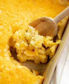 a casserole dish with a wooden spoon in it