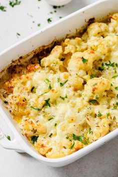 a casserole dish filled with cauliflower and cheese