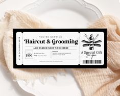 a haircut and grooming ticket sitting on top of a white plate