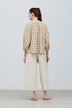 The Annelise Plaid Blouse is made from soft and comfortable cotton, this blouse features raglan sleeves for added movement, a round neckline for a classic look, and a shell button front closure for ease. The ivory, yellow, and taupe plaid is perfect for both casual and formal occasions, this blouse is a versatile addition to any wardrobe. Material100% CottonLightweight cotton lawnButton Front ClosurePearl buttonsEasy fitTrue to sizeWash cold, hang to dry Model FitMegan is wearing size MModel is Cream Cotton Top For Daywear, Cream Cotton Blouse For Everyday, Beige Relaxed Fit Cotton Blouse, Beige Cotton Daywear Blouse, Beige Cotton Blouse For Daywear, Relaxed Fit Plaid Blouse For Daywear, Beige Blouse For Daywear In Fall, Relaxed Fit Beige Blouse For Casual Gatherings, Cream Cotton Blouse For Work