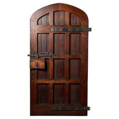 an old wooden door with iron bars on it