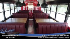 the inside of a restaurant with red booths