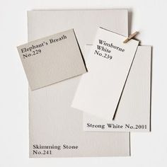 three white cards with black writing on them