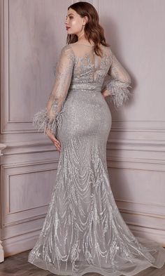 Enhance your visual appeal in this luxurious Cinderella Divine CB090C creation. Amazing embroidery in sheer fabric, this long evening dress features an illusion bateau neckline with sweetheart lining, long sleeves accented with feather fringes, and an illusion open back with zipper closure. The sheath skirt glimmers with lovely blossoms as it falls down into a full-length hemline in a sweep train. Look sophisticated and mature in this simple yet chic Cinderella Divine masterpiece. Whether you ar Long Gown With Sleeves, Anniversary Dresses, Glitter Gown, Sheer Long Sleeve Dress, Formal Prom Dresses Long, Cinderella Divine, Unique Prom Dresses, Cinderella Dresses, Glitter Print