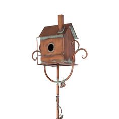 a birdhouse on a metal stand with an iron rod holding it's roof