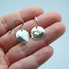 Easily transition from the office to happy hour with these handmade hammered disc earrings. They are very lightweight and make a great everyday earring for all seasons and all ages. Extra Large - 1 1/4 inches in diameter Large - 1 inch in diameter Small - 1/2 inch in diameter (shown on model) All pieces will be packaged together in a cotton filled jewelry box unless otherwise specified. Please let us know if your order is a gift and we will gladly include a handwritten note and complimentary gif Earrings Circle, Hammered Earrings, Gold Disc, Disc Earrings, Everyday Earrings, Happy Hour, Gift Wrap, All Seasons, The Office