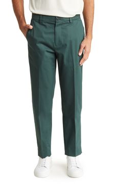 A classic pair of preppy chino pants are crafted from a stretch-cotton blend for comfort and style. 10 3/4" rise, 32" inseam Zip fly with button closure
 97% cotton, 3% spandex Machine wash, tumble dry
 Imported Solid Cotton Ankle-length Dress Pants, Green Tapered Leg Chino Cotton Twill Bottoms, Green Chino Cotton Twill Chinos For Work, Green Chinos For Workwear, Green Tapered Leg Chino Bottoms, Green Dress Pants With Welt Pockets For Business Casual, Fitted Green Chinos With Welt Pockets, Formal Chino Cotton Twill Pants For Spring, Green Chino Cotton Twill Bottoms For Work