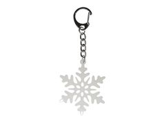 a snowflake shaped keychain on a white background