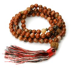 Jasper and Rudraksha 8mm Knotted Mala with Silk Tassel Approx 44" long including 3 1/4" tassel. Strung and knotted on silk cord Bead size : 8mm Adjustable Hand-strung Brown Mala, Adjustable Brown Hand-strung Mala, Gift Brown Hand Knotted Mala, Brown Hand Knotted Mala As Gift, Brown Hand-knotted Mala As Gift, Adjustable Hand Knotted Mala For Meditation, Brown Hand Knotted Mala For Healing, Hand Knotted Brown Mala For Healing, Adjustable Artisan Mala For Rituals