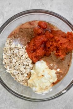 the ingredients for an oatmeal smoothie in a glass bowl