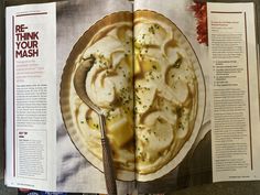 an open magazine with food on it and a spoon in the bowl next to it