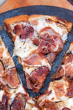 a close up of a pizza on a pan with one slice taken out of it