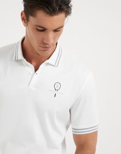 Cotton jersey polo with striped collar and tennis logo The sporty yet elegant feel of the world of Tennis inspires a selection of creations that enrich the Men’s collection. This soft cotton jersey polo shirt is characterized by the contrast color stripes on the collar, adding a distinct touch to the garment’s classic lines. The Tennis logo complements the style with a refined detail, while the fit offers regular proportions. Classic Three Stripes Polo Shirt, Classic Three-stripes Polo Shirt, Luxury White Polo Shirt With Ribbed Collar, Classic Polo Shirt With Striped Collar For Golf, Sporty Golf Polo Shirt With Striped Collar, Sporty Polo Shirt With Striped Collar For Golf, White Sporty Polo Shirt With Embroidered Logo, White Collared Polo Shirt With Signature Stripes, Sporty Polo Shirt With Striped Collar