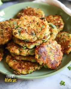 a green plate topped with crab cakes on top of a white marble countertop next to a cup of coffee