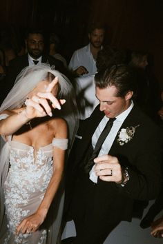 the bride and groom are dancing together at their wedding