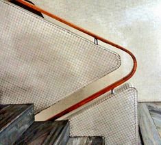 a drawing of a stair case with an orange handrail and mesh covering the railings