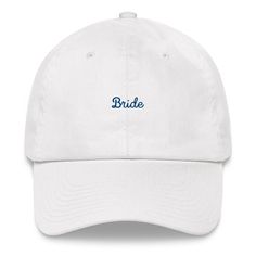 "White hat with \"Bride\" embroidered in navy. This one's got a low profile with an adjustable strap and curved visor. * 100% chino cotton twill * Green Camo color is 35% chino cotton twill, 65% polyester * Unstructured, 6-panel, low-profile * 6 embroidered eyelets * 3 ⅛\" (7.6 cm) crown * Adjustable strap with antique buckle * Blank product sourced from Vietnam or Bangladesh" Novelty Hats, Visor Cap, Embroidered Hat, Embroidered Caps, Camo Colors, White Hat, Embroidered Hats, Green Camo, Pattern Phone Case