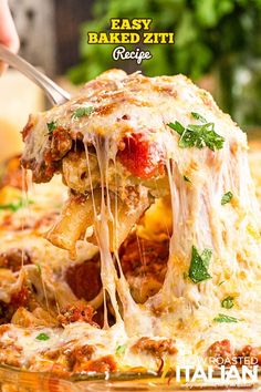 a close up of a slice of pizza being lifted from the casserole dish