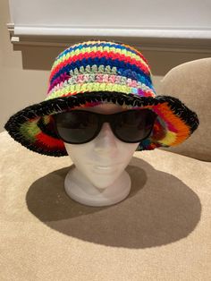 "hand crocheted bucket hat with silver thread brim Size: S-L Crown: 6.5\" Height: 9.5\" Width:12\" Head curcumference: 21-24\" Great hand crocheted bucket hat with silver thread brim" Cotton Yarn Crochet Hat With Curved Brim, Casual Crochet Sun Hat With Flat Brim, Adjustable Crochet Hat With Flat Brim, Crochet Straw-like Hat With Curved Brim, Crochet Straw Hat With Curved Brim, Crochet Yarn Straw Hat With Curved Brim, Knitted Yarn Bucket Hat One Size, Adjustable Multicolor Crochet Hat With Flat Brim, Brimmed Yarn Sun Hat With Crochet Details