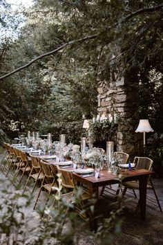 a long table set up for an outdoor dinner