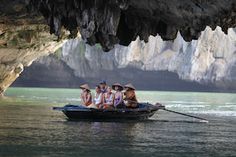 four women in hats are on a small boat