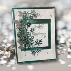 a close up of a card on a table with confetti scattered around it