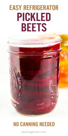 a jar filled with pickled beets sitting on top of a table