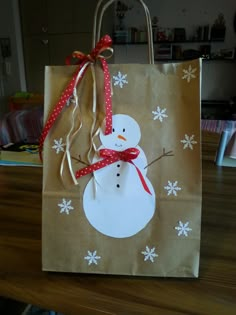 a brown paper bag with a snowman on it