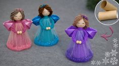 three little angel figurines sitting on top of a table next to rolled up toilet paper