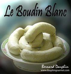 there is a white plate with food on it and the words le boudin blanc