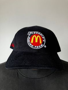 New & unworn Bill Elliott McDonalds Ford Crew Snapback hat from 1994 by Track Gear. Black cotton cap with embroidered logos, mint shape, OSFA. 90s Style Curved Brim Baseball Cap For Streetwear, 90s Curved Brim Streetwear Hat, 90s Streetwear Baseball Cap With Curved Brim, 90s Style Trucker Hat, 90s Style Baseball Cap For Streetwear, Throwback Fitted Flat Bill Hat, Fitted Black Snapback Hat With Curved Bill, Black Flat Bill Hat For Fan Merchandise, Black Fitted Snapback Hat With Curved Bill