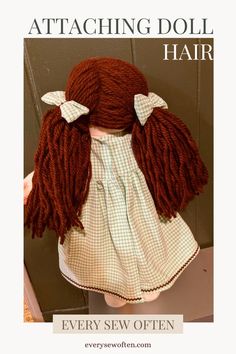 an image of a doll with long hair