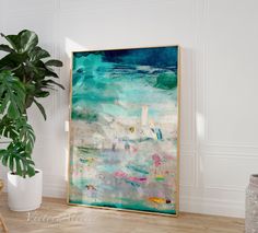 a painting on the wall next to a potted plant in a room with white walls