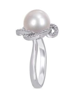 This modern and sophisticated Belk & Co. crossover halo ring is crafted in lustrous 14-karat White Gold and features an eye-catching solitaire cultured freshwater pearl at the center of its unique 56 round-cut, prong-set 1/4 ct. t.w. Diamond halo design. Instantly add a touch of elegance and class to any ensemble with this stunning pearl and diamond ring. | Belk & Co 1/4 ct. t.w. Diamond and 10 to 10.5 Millimeter Cultured Freshwater Pearl Swirl Ring in 14k White Gold, 7 Elegant Bypass Ring With Pave Setting For Formal Events, Modern Twist White Jewelry For Formal Occasions, Elegant Diamond White Bypass Ring For Formal Occasions, Elegant Formal Bypass Ring With Prong Setting, Modern White Jewelry With Diamond Accents, Modern White Round Rings, Elegant Bypass Ring With Diamond Accents, Formal Pearl Ring With Halo Design, Elegant White Gold Bypass Ring