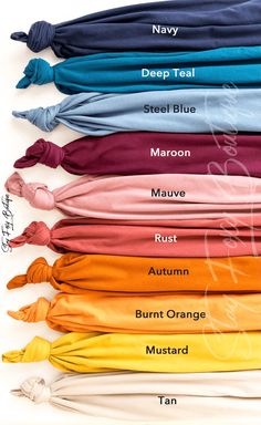 different colors of scarves with names on them