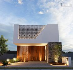 the entrance to a modern house with wooden doors and lights on it's side