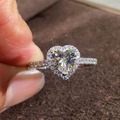 Heart Halo Engagement Rings, Love Heart Shaped Pave Diamond Ring, 2 Carat Promise Ring, 1 CT Anniversary Ring, 3 Carat Moissanite Ring We use the highest quality moissanite! Moissanite: ✦ Color: D Colorless ✦ Clarity: VVS1 ✦ Cut: Excellent OR All our diamonds are 100% natural. We use only conflict-free diamonds and gemstones. Diamond: ✦ Color: F-G ✦ Clarity: SI1-VS ✦PRODUCT DETAILS✦ → Center stone: Heart Cut Moissanite 1.0ct (Photo/video shown) → Side stones: Moissanite Also available in diamond Heart Cut Ring, Heart Halo, Heart Shaped Diamond Ring, Mothers Day Rings, Heart Engagement Rings