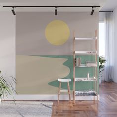 a living room wall mural with an orange, yellow and grey circle on the side